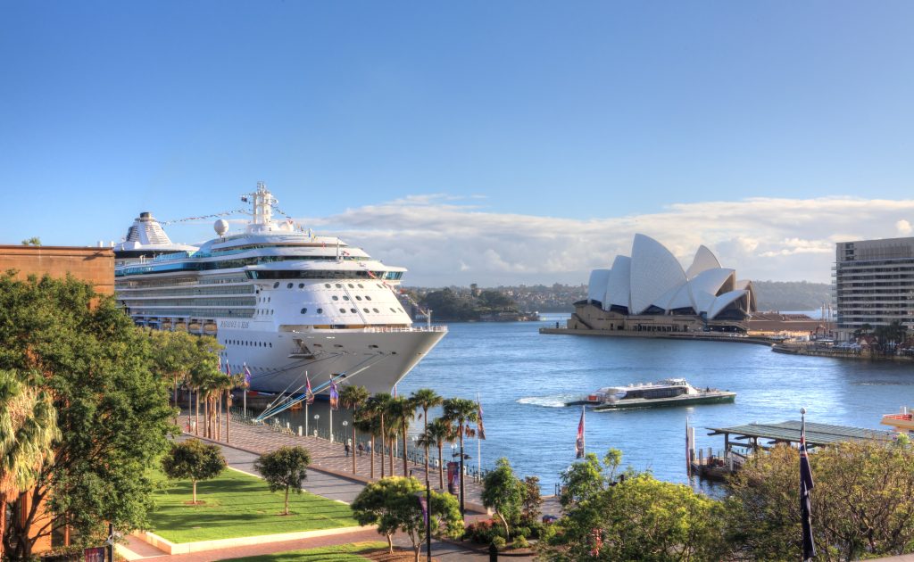 Royal Carribean Cruise Liner, Radiance of the Seas docked at Circular Quay in Sydney. Sydney Opera House in the background - Viking Travel