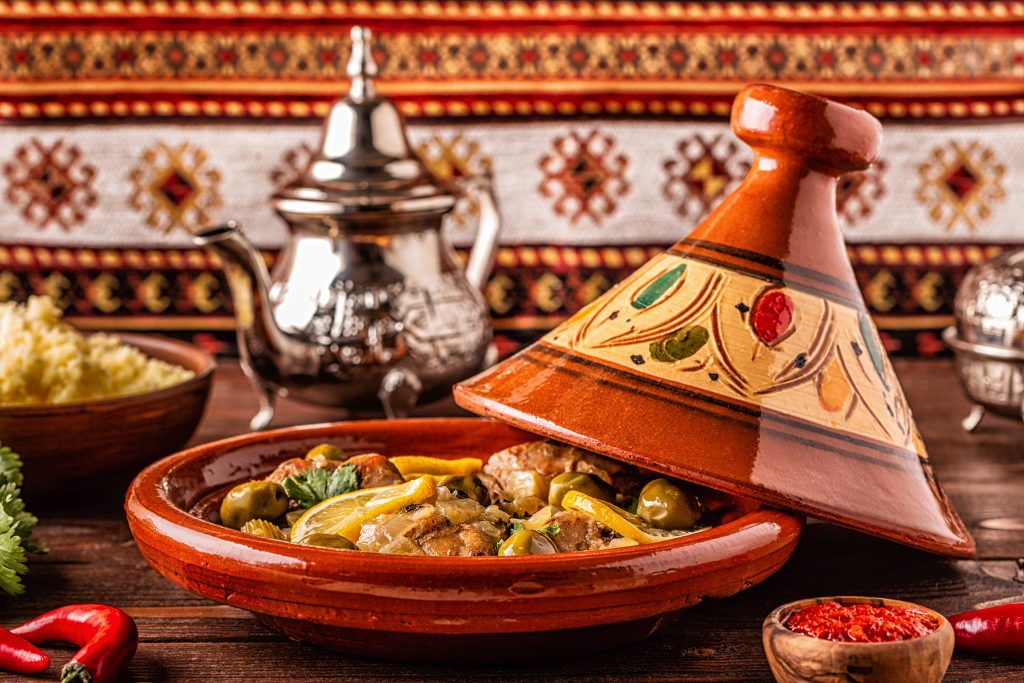 Traditional Moroccan chicken tagine with olives and salted lemons, selective focus - Viking Travel