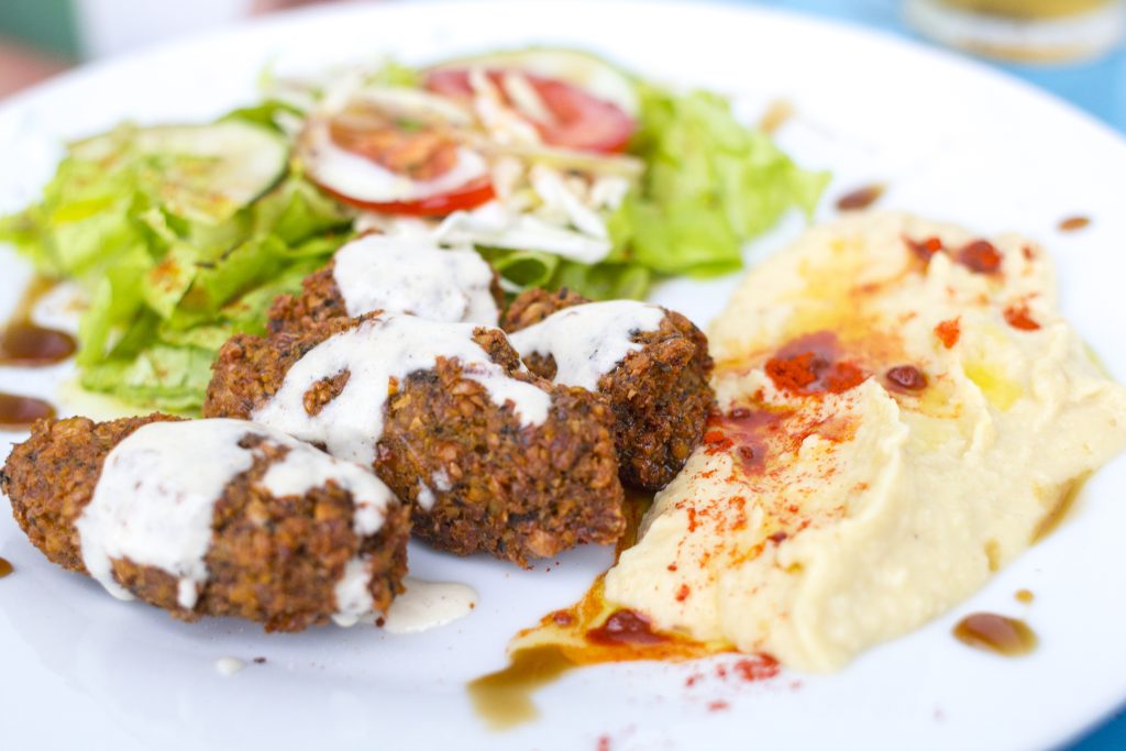 Turkish / Arabian food. Falafel with hummus and salad - Viking Travel